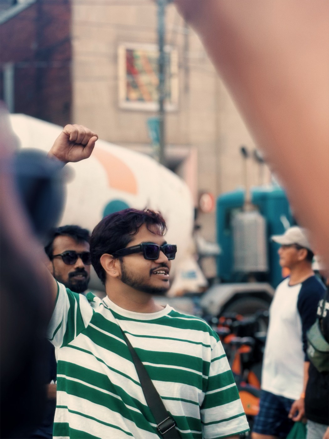 Satvik at a protest, fist raised