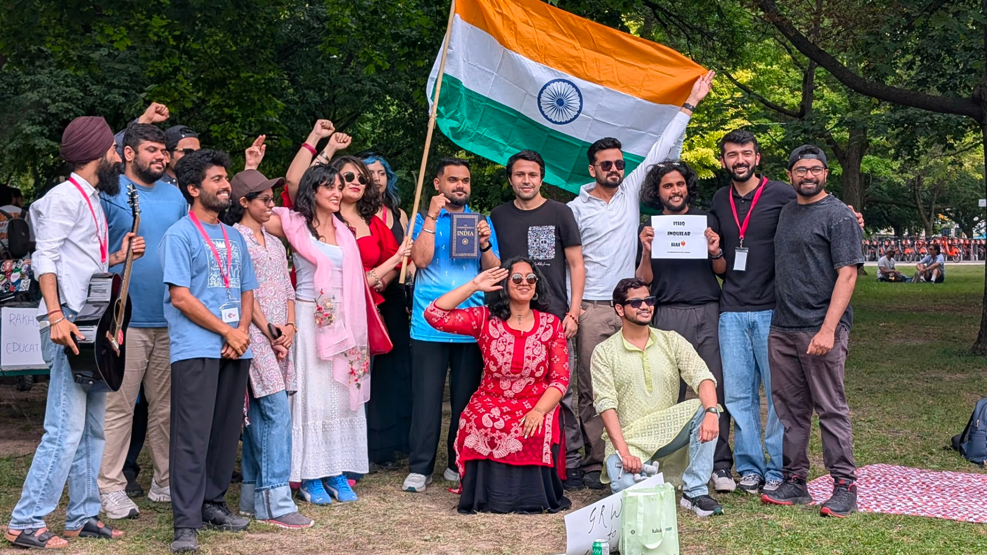 Group gathering with the Indian flag at a Firdaus-e-Inqalaab event