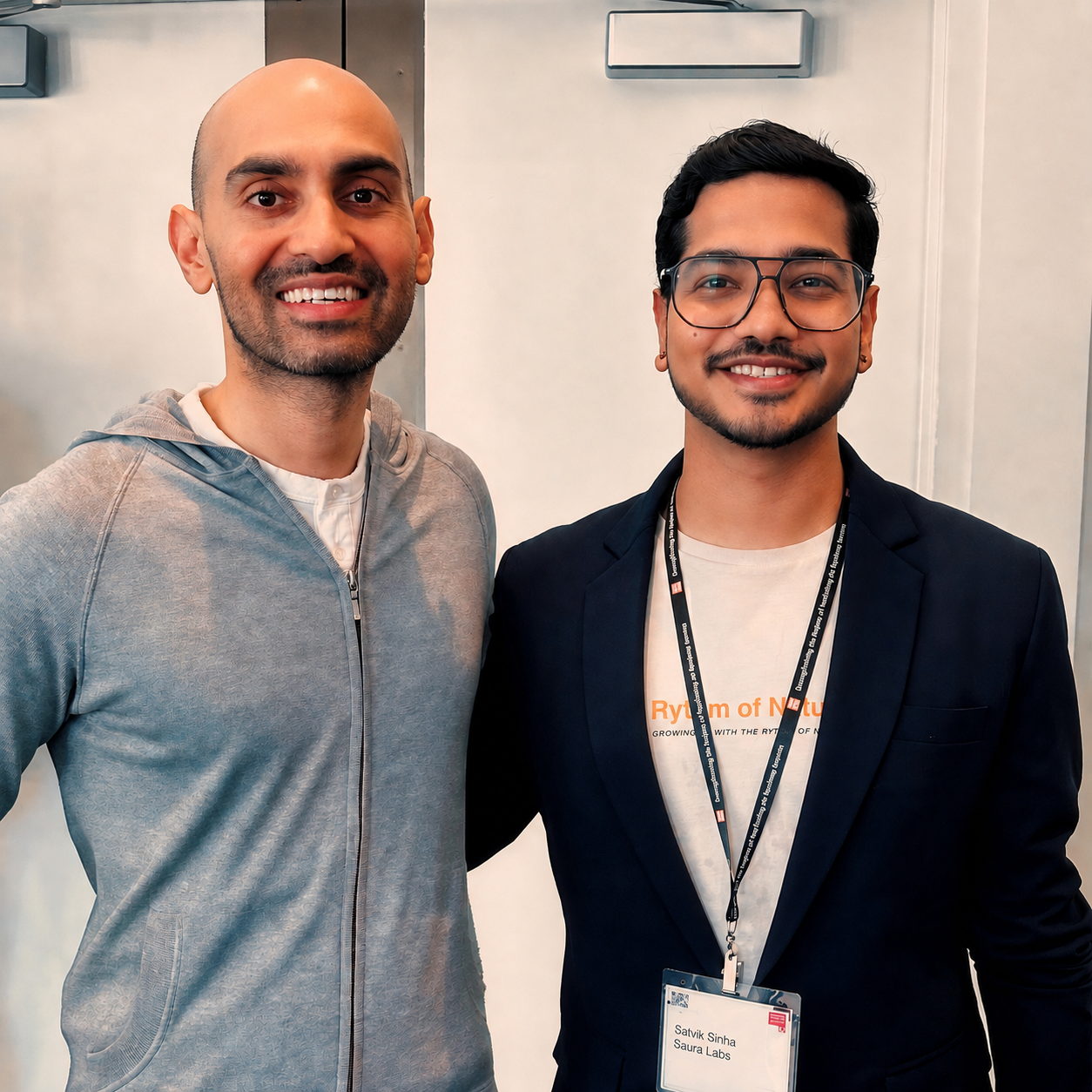 Satvik Sinha standing with Neil Patel at an industry event